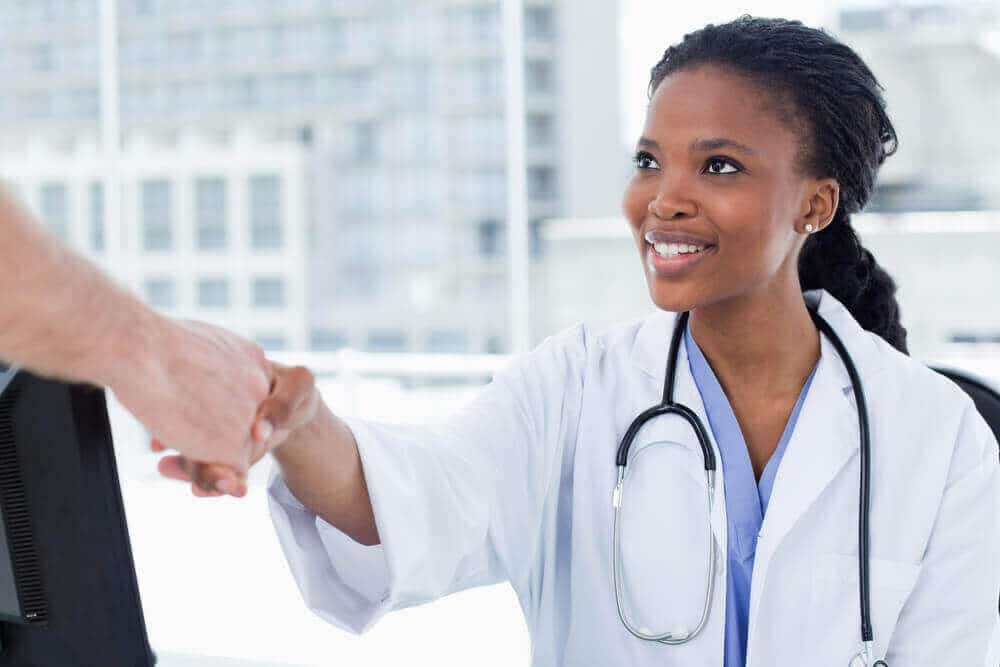 young physicians shaking hands
