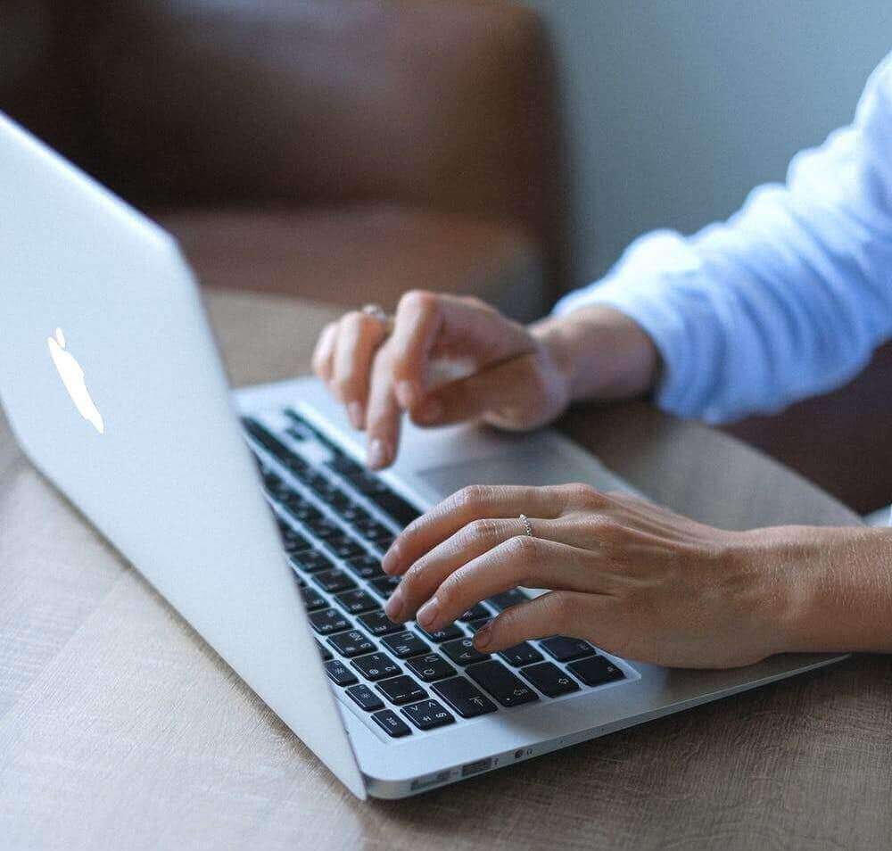 Person typing on computer