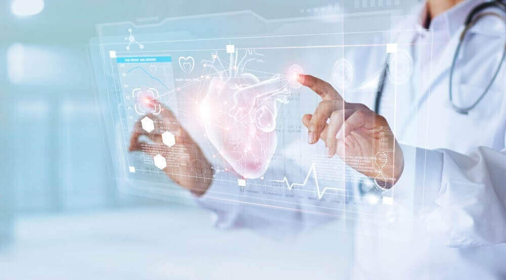 Surgeon looking at heart diagram on screen