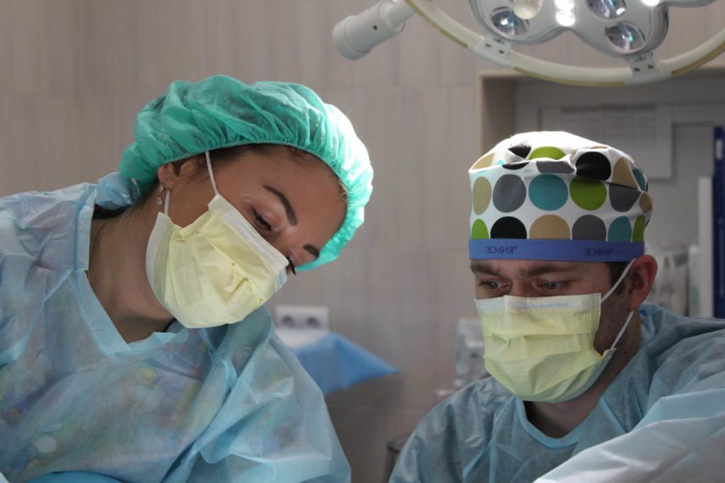 Two surgeons performing a surgery