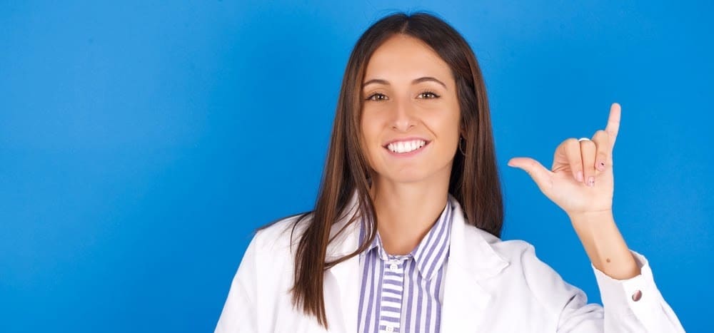 hawaii-medical-licenseYoung european doctor woman on blue background showing up number six Liu with fingers gesture in sign Chinese language